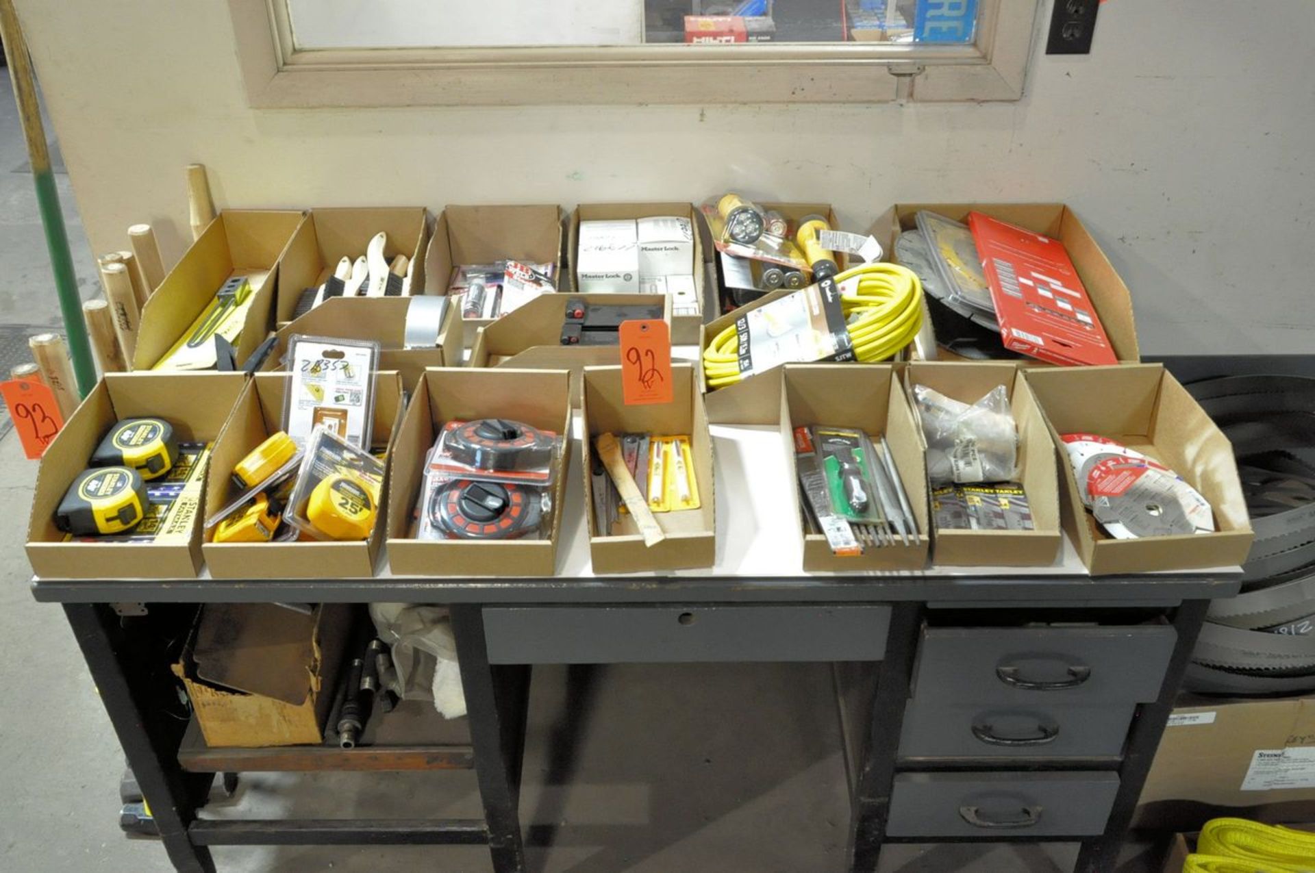 Lot - Tape Measures, Levels, Wire Brushes, Batteries, Flashlights, Saw Blades, etc. on (1) Desk Top,