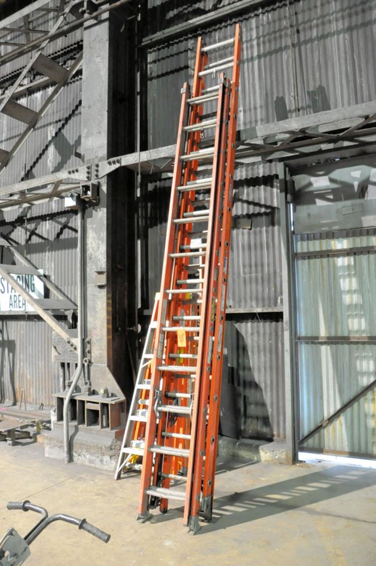 Lot - (1) 28' and (1) 24' Fiberglass Extension Ladders, (Mill Annex)