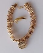 A gate-link yellow gold bracelet, 16 cm, stamped 15ct with two charms