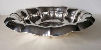 A large circular 800 silver lobed dish with inverted rim on a flat base