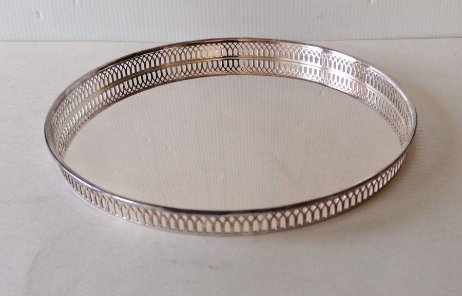 A cased circular drinks silver tray with pierced gallery, hallmarked for Barker Ellis Silver Co.