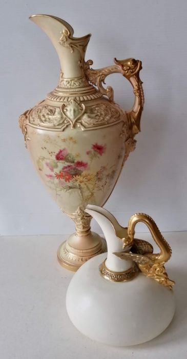 A large Royal Worcester blush ivory ewer, the frieze decorated with cherubs and grotesque masks