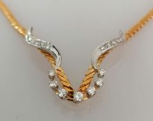 A white and yellow gold integrated necklace with six round brilliant-cut diamonds in a mounted claw