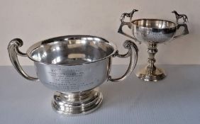 A George V silver two-handled trophy cup on a stepped base, with inscription relating to The Cumberl