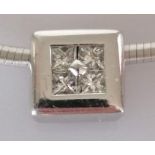 A diamond pendant, set with four princess-cut diamonds, weighing an estimated total of 0.35 carats