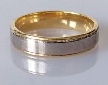 A white and yellow gold wedding band, size T, hallmarked 750, 5.8g with Goldsmiths packaging