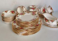 A fifty-piece Royal Albert Old Country Roses tea service comprising eight cups/saucers/plates