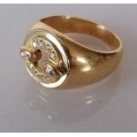 A diamond and yellow gold signet ring with tapering shank, bearing a Cartier signature