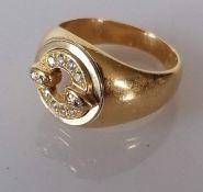 A diamond and yellow gold signet ring with tapering shank, bearing a Cartier signature