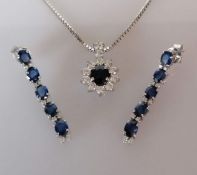 A sapphire and diamond demi-parure comprising a cluster pendant with an oval-cut sapphire