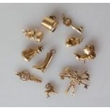 An assortment of 9ct gold charms, hallmarked, 18g