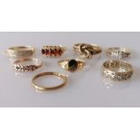 An assortment of eight 9ct gold rings, some gem-set, various sizes/dates, all hallmarked, 22g
