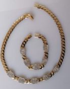 A 9ct yellow gold flat curb-link necklace, 42 cm, with double 'C' feature design