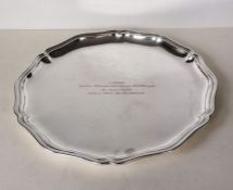 A circular 800 silver tray with wavy rim border, inscribed, 30 cm, 447g
