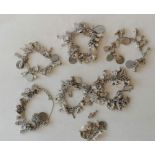 A selection of six silver charm bracelets, 554g