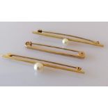 Four 9ct gold tie pins, two with pearl decoration, one with a carnelian, stamped and hallmarked