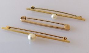 Four 9ct gold tie pins, two with pearl decoration, one with a carnelian, stamped and hallmarked