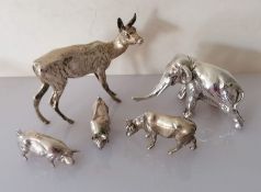 A silver menagerie to include a deer, elephant, two pigs and a cow, all hallmarked for SS, London