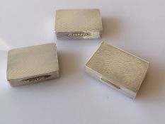 Three cased contemporary silver pill or snuff boxes with gilt interiors, engine turned decoration
