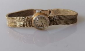 A vintage ladies Omega wristwatch with 9ct gold case and mesh bracelet strap, hallmarked, 22.3g with