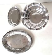 A lobed silver bowl with inverted rim on a circular base