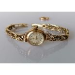 A mid century Tissot ladies manual wristwatch with a 9ct yellow gold case and bracelet, hallmarked,