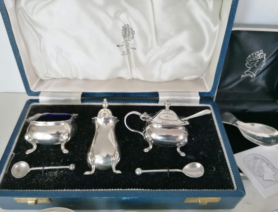 A cased Mappin & Webb three-piece cruet set with wavy rim borders, Sheffield, 1969; a Walker & Hall  - Image 2 of 5