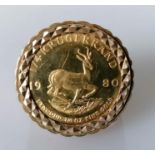 A 1980 1/4 Fine Gold Krugerrand on a 9ct gold ring mount, size V, hallmarked 9ct, 16.26g