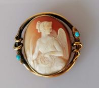 A Victorian cameo brooch in an elaborate gold surround in the form of a coiled snake with turquoise 