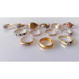 An assortment of ten 9ct gold rings, most gem-set, 23.68g; two 18ct gold rings, 6g