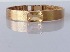 An emerald-cut citrine-mounted gold bracelet with textured strap, adjustable clasp, 28.6g