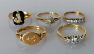 A three-stone graduated diamond ring on a yellow gold and platinum setting