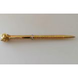 A yellow gold textured ballpoint pen with applied tiger head and diamond girdle