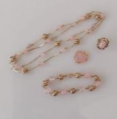 A vintage Austrian gold parure comprising a necklace of pink glass beads, baton links and pierced sp