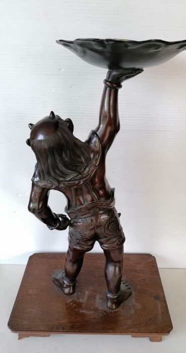 A Japanese bronze figure of Oni, modelled supporting a lotus-form candle stand, moulded signature - Image 3 of 4