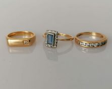A yellow gold signet ring with diamond decoration; an Art Deco oblong sapphire and diamond cluster 