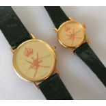A Kutchinsky his/hers watch set with Oman logo on faces, champagne dials 32, 20mm without crowns