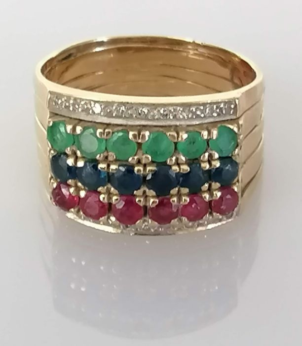 A composition ruby, sapphire and emerald stacking ring with diamond decoration