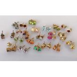 An assortment of twenty-one pairs of gem-set stud earrings, all in a 9ct gold setting, all hallmarke