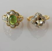 A peridot and diamond cocktail ring on an 18ct gold setting, the cabochon peridot 8 x 7mm