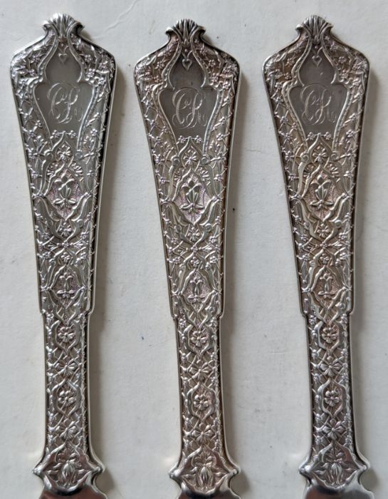 A set of eleven Art Nouveau Tiffany & Co. silver 'Persian' pattern knives, designed by Edward C. Moo