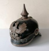 A WWI era Imperial German Pickelhaube spiked helmet with helmet badge