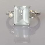 An aquamarine and diamond dress ring on a white gold setting
