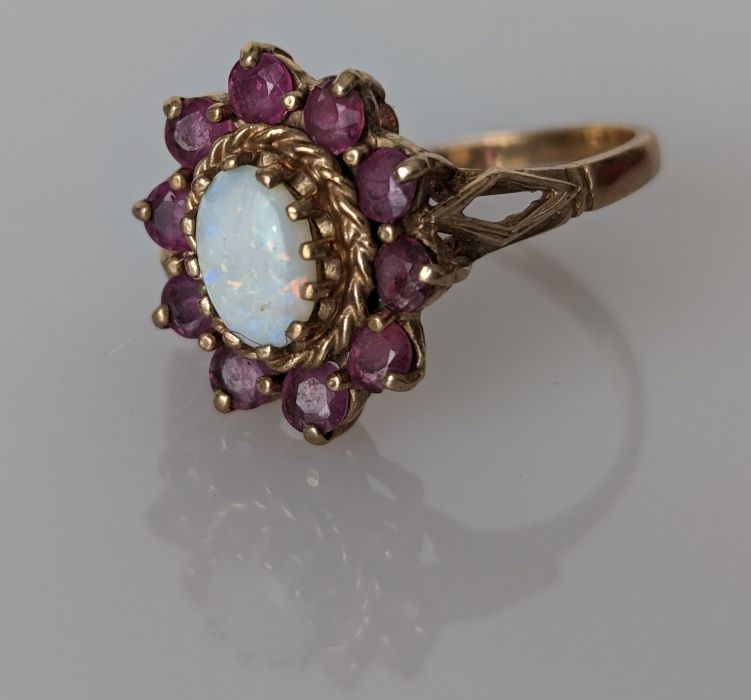Four gem-set rings stamped or testing for 18ct gold, 8g; a 9ct gold opal and garnet ring - Image 2 of 4