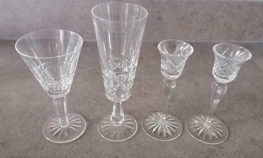 A set of eight Waterford Crystal wine or water glasses, 16 cm H and six champagne flutes, 20.5 cm H