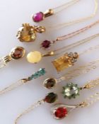 An assortment of eleven gem-set pendant chains on 9ct gold settings, all hallmarked, 25g (11)