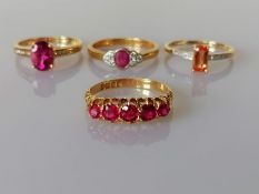 A George V five-stone ruby ring on a gold claw setting, largest stone 0.20 carats
