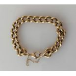 A 9ct yellow gold curb-link bracelet, 14 cm, hallmarked, 33.4g