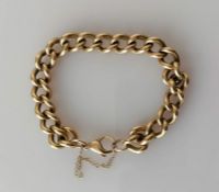 A 9ct yellow gold curb-link bracelet, 14 cm, hallmarked, 33.4g