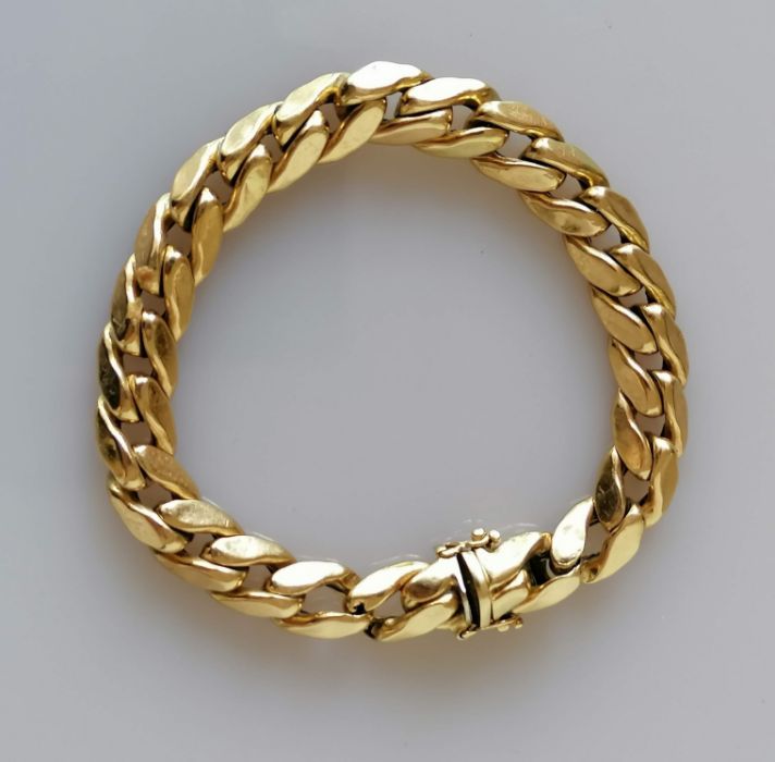 A yellow gold flat curb-link bracelet (three extra links) 19 cm, stamped 585, 21.3g